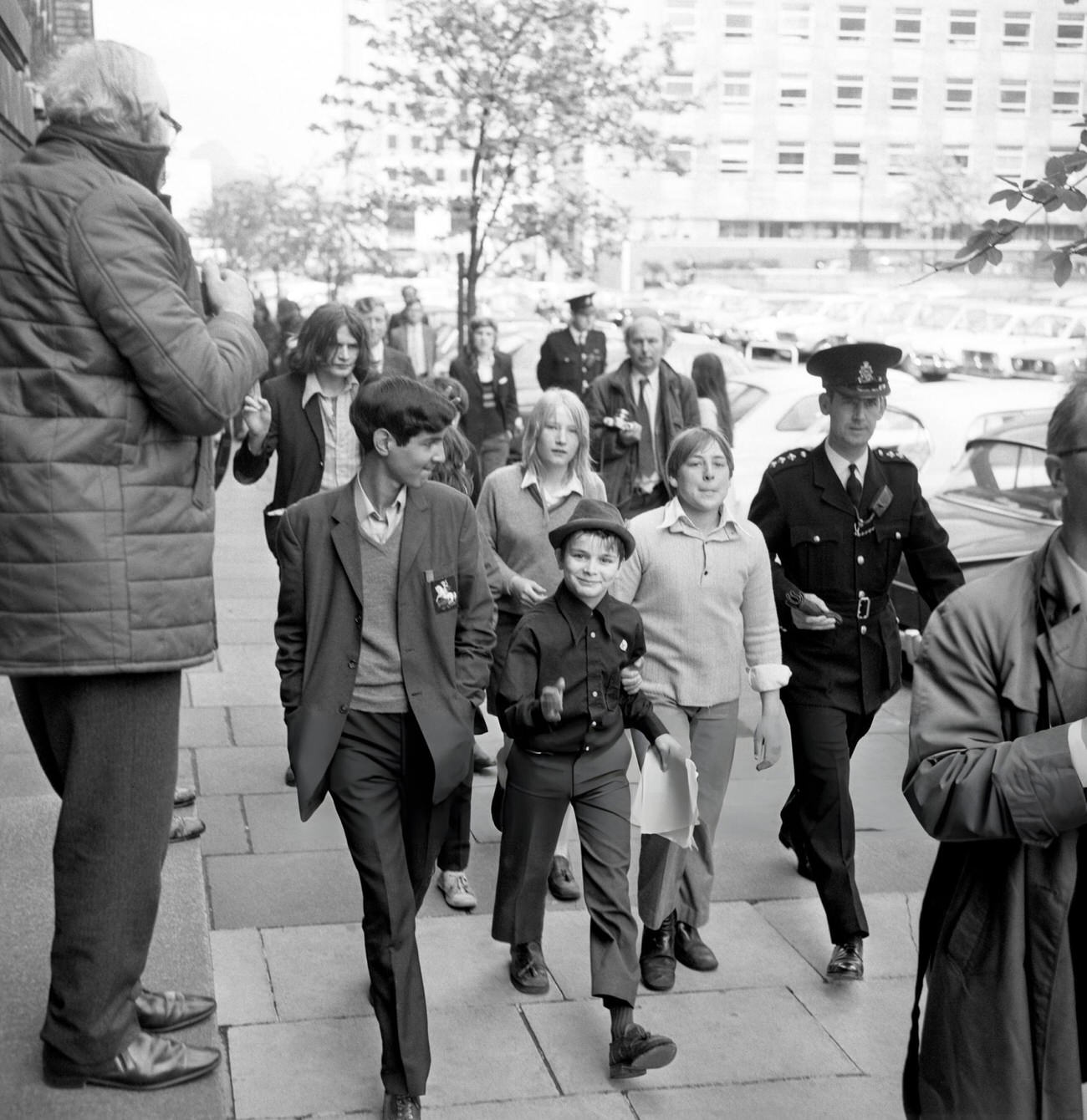 Schoolchildren taking part in a 'pupil power' demonstration march towards County Hall, 1972.