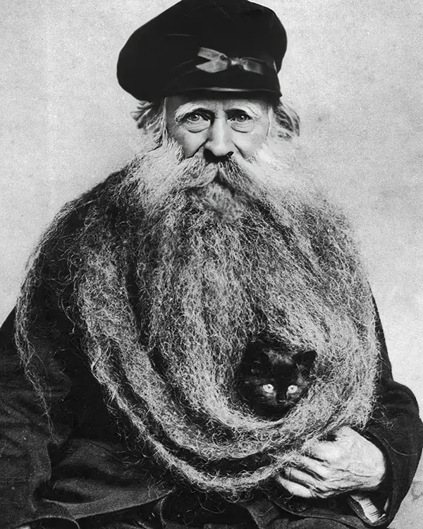 Louis Coulon with his kitten in 1890.