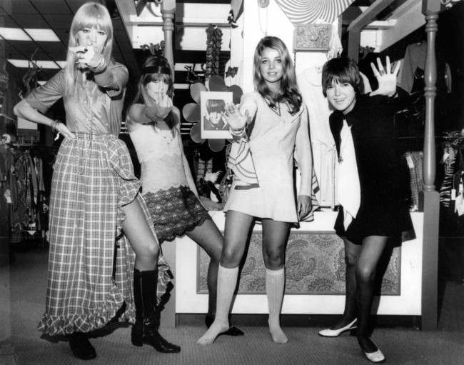 Mary Quant waves as she poses with models on Oct. 25, 1968. The models, from left, are, Amanda Tear, Rory Davis and Penny Yates.