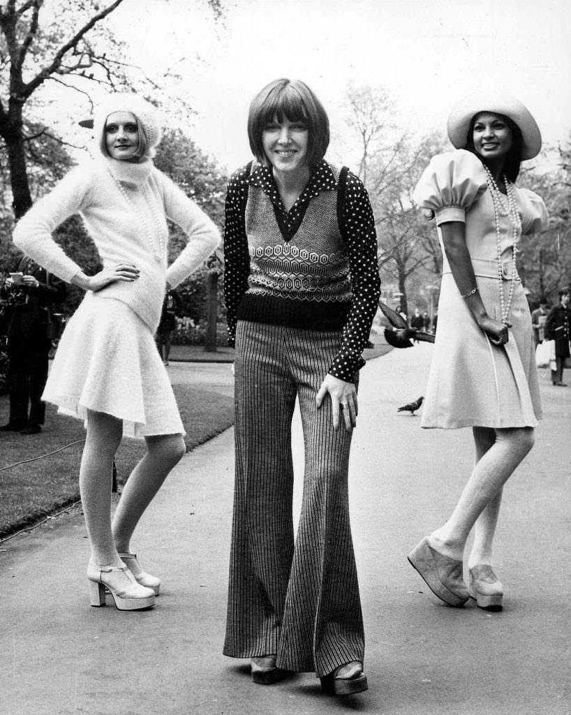 Mary Quant – posing with two of her autumn collection outfits in May 1972