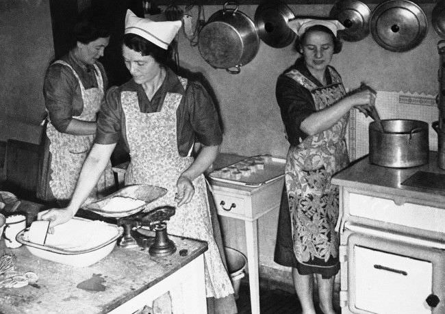 Voluntary workers in the communal kitchen preparing meals, some of which will be eaten by employees in nearby factories in London on Sept. 17, 1941.