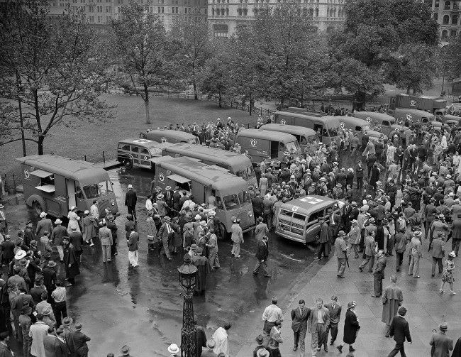 Crowds inspect the 14 mobile disaster units dedicated to the Red Cross in New York, June 27, 1942, by the Masons of New York state.