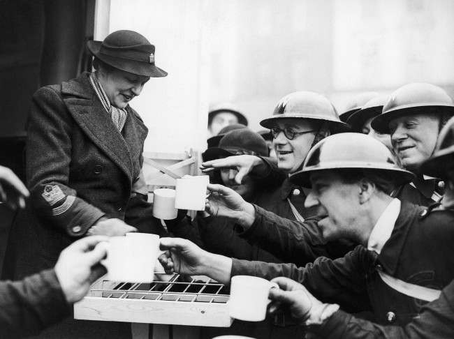 Mrs. Montagu Norman, the wife of the governor of the Bank of England, handing out tea to the A.R.P. workers after she had opened the canteen at Islington Town Hall, Jan. 15, 1940.