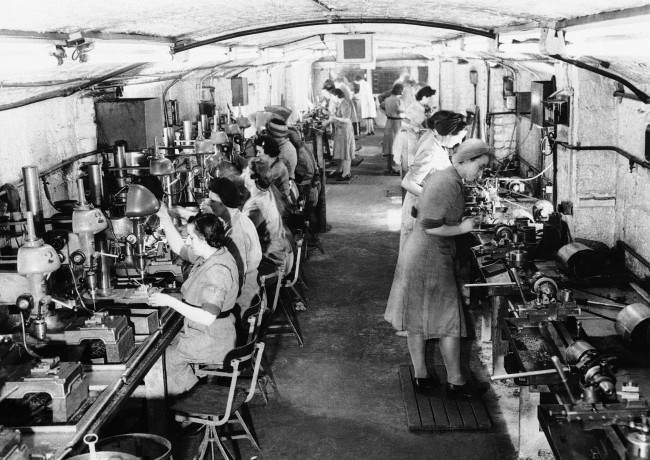 Housed in 20 underground tunnels Âsomewhere on the West Coast of England several hundred women are turning out war materials in complete safety from air raids.