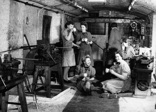 Time out for a cup of tea during a five-minute morning break in the underground factory in England April 11, 1944.