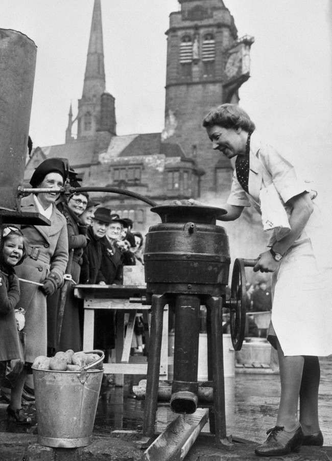 A lady operates a semi-mobile canteen on the streets of Coventry following Lord Woolton’s statement that the Ministry of Food had completed arrangements for feeding 20 percent of the population of Great Britain and Northern Ireland in the event of an emergency.