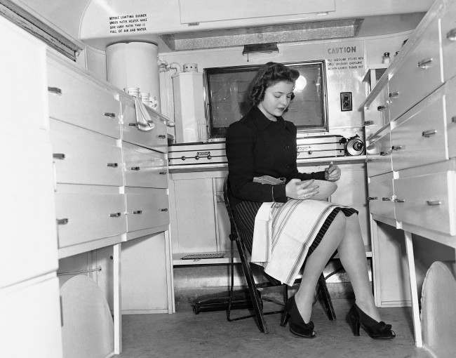 A woman works in a mobile Kitchen, Feb. 15, 1941.