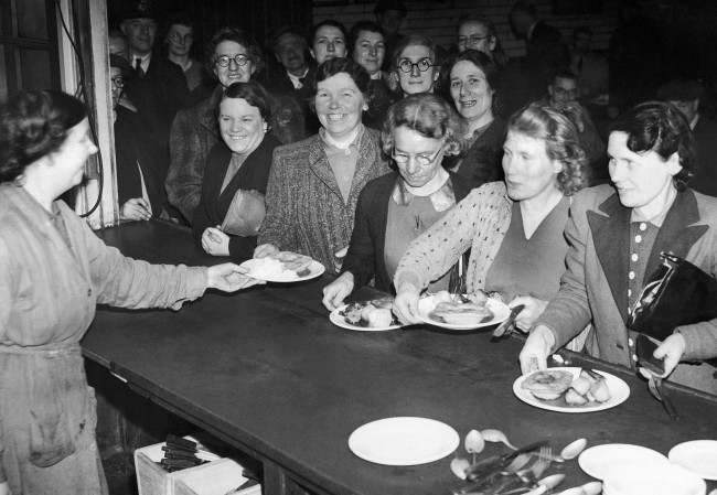 Nearly half of the post office staff consists of women now that the men are being absorbed into the forces.