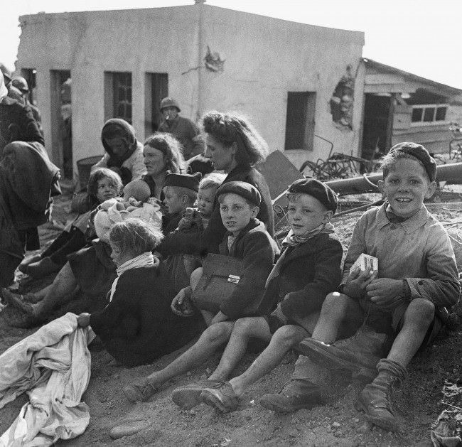 French civilian refugees sought refuge in a beachhead area in Normandy, 1944.