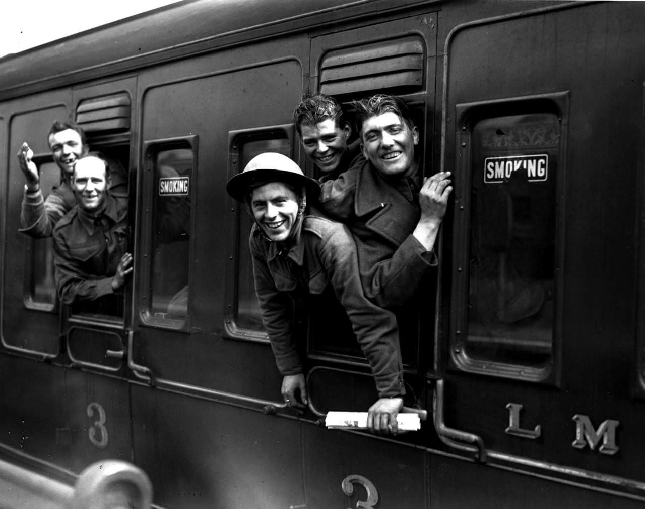 Members of the British forces arrive home by train after being evacuated from Dunkirk, 1940.