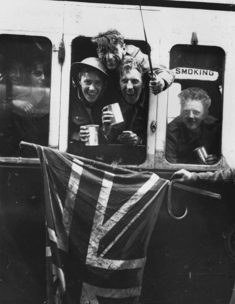 Operation Dynamo: Members of the British Expeditionary Force arrive back in Britain with a Union Jack after being evacuated from Dunkirk, 1940.