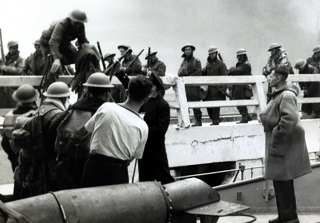 British troops being helped board rescue craft from the pier during the Battle of Dunkirk during World War II, 1940s.