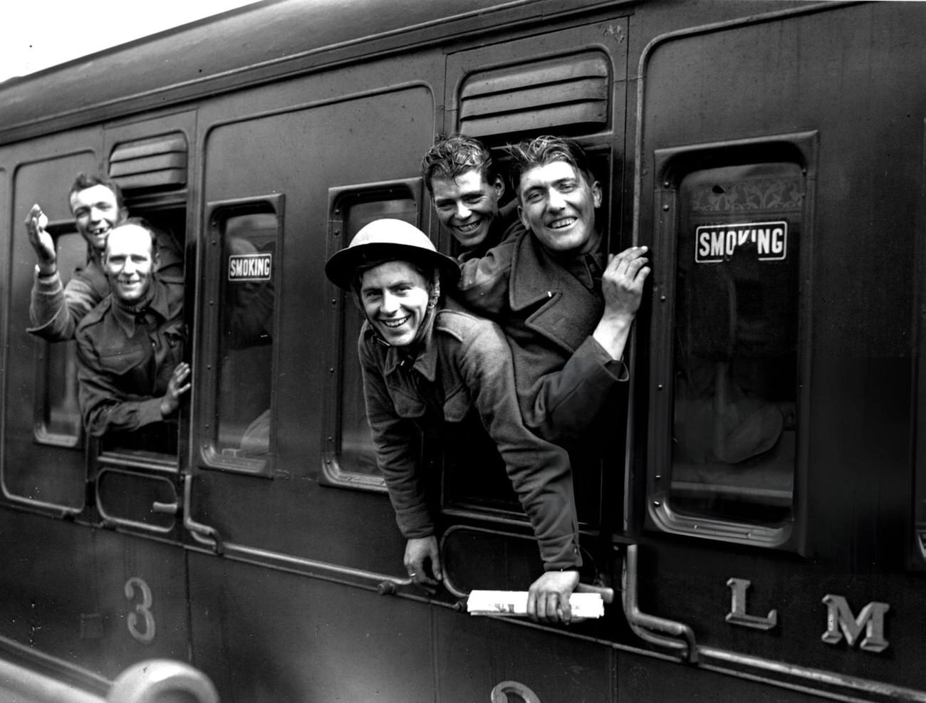 Members of the British forces arrive home by train after being evacuated from Dunkirk, 1940.