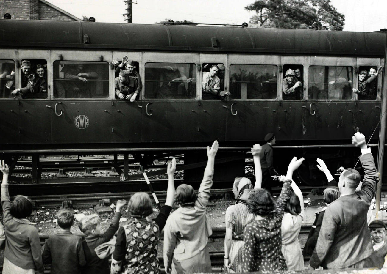 Men of the French Army greeted by villagers at a Kent railway station after their evacuation from France during the Battle of Dunkirk, 1940s.