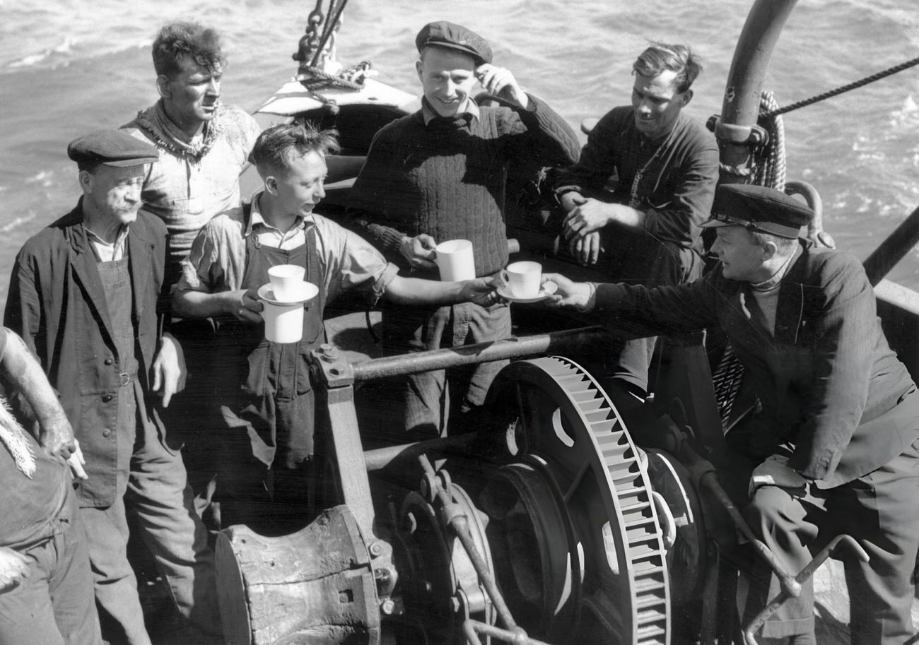 The crew of the London based tug 'Sunvill', one of the many small craft which took part in the evacuation of British and allied troops from Dunkirk, 1940.