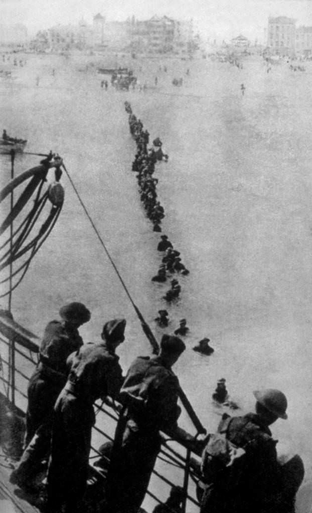 Retreating soldiers struggling through the sea because the waiting ships could not get closer to the Dunkirk beach, 1940.