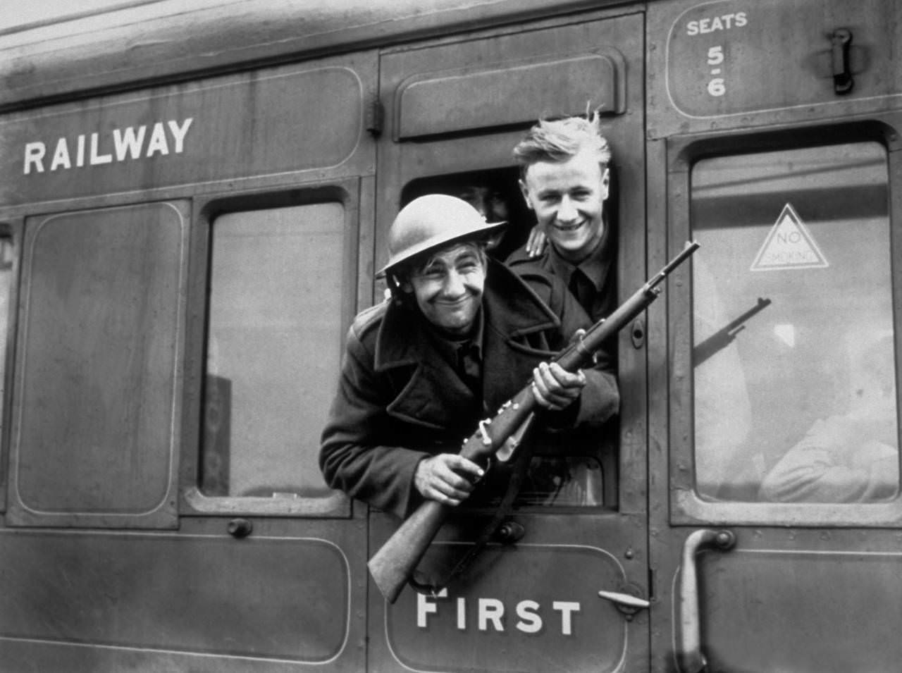 Troops continue to arrive home in their thousands following the rescue of the British Expeditionary Forces at Dunkirk. This member of the BEF has brought a German rifle home as a souvenir, 1940.