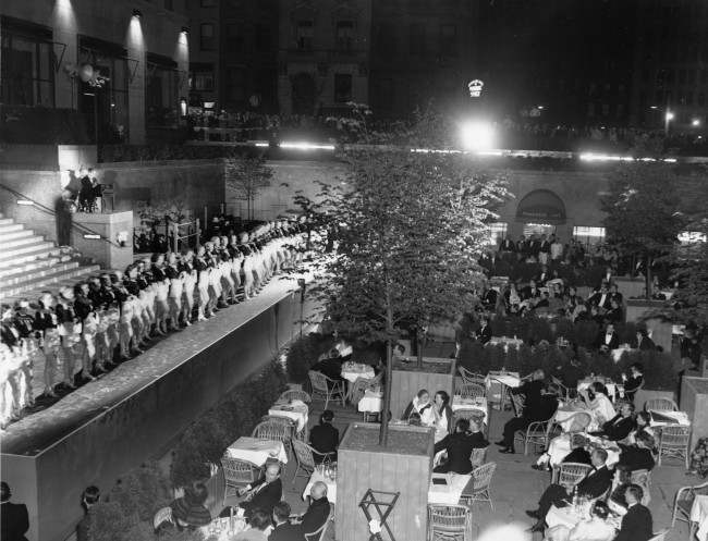 The Radio City Rockettes perform during the opening night of the outdoor restaurant at the central sunken plaza at Rockefeller Center, New York City, 1936.