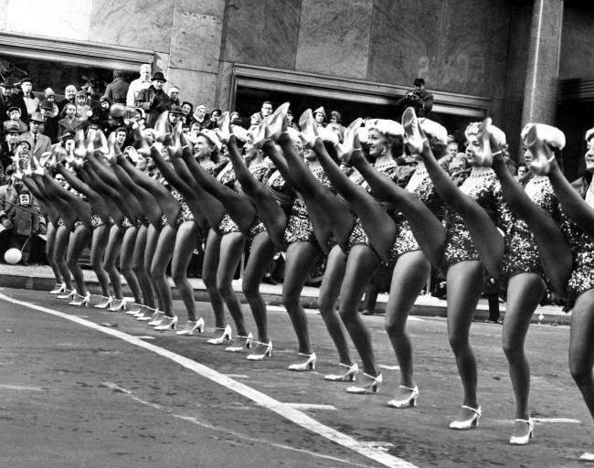 Some of the Radio City Music Hall Rockettes performing in the annual Macy's Thanksgiving Day parade, 1958.