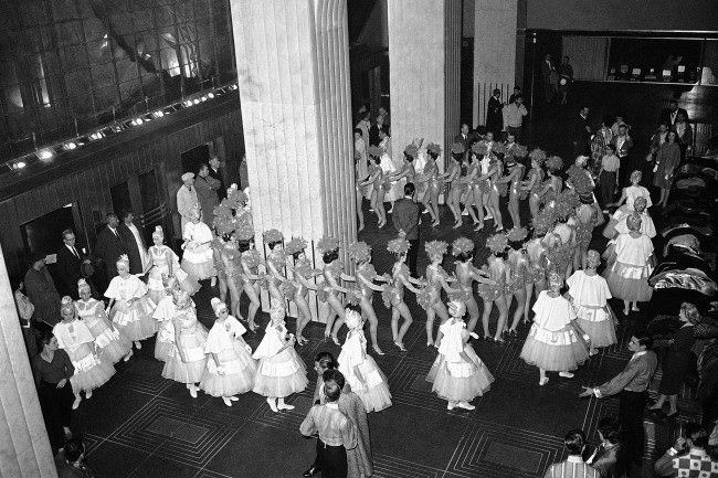 A last minute run-through of their routine is held by the Radio City Music Hall Rockettes in the lobby of the RCA Building, 1962.