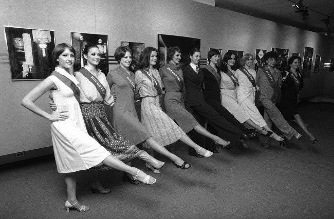 Radio City Music Hall Rockettes kick for the cameras at a photo exhibit showing the art deco interior of the famed hall, 1978.