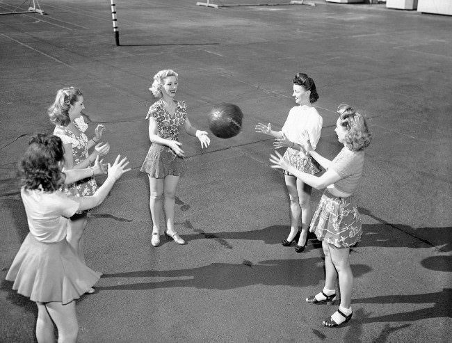 Some Rockettes get exercise with a medicine ball on the Music Hall roof, 1946.