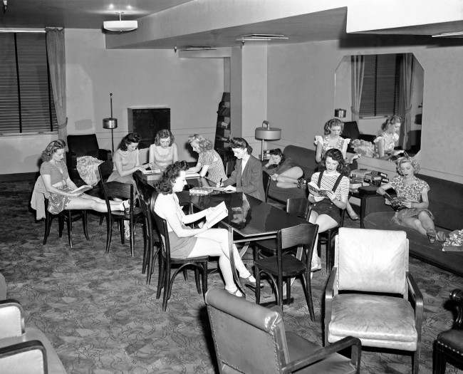 Some Rockettes relax in the library-lounge backstage at Radio City Music Hall, 1946.