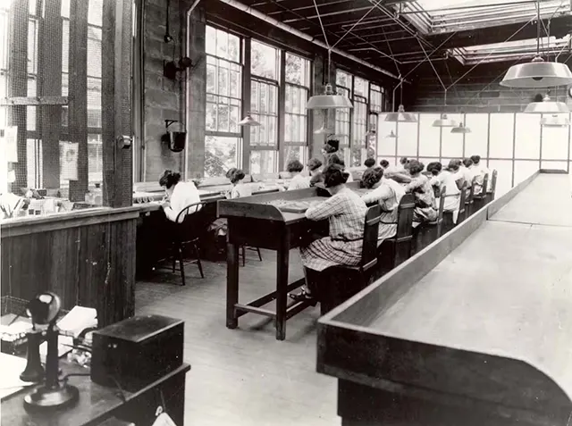 Radium painters working in a factory.