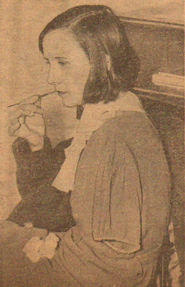 Dial painter Charlotte Purcell demonstrating the ‘lip pointing’ technique used by factory workers.