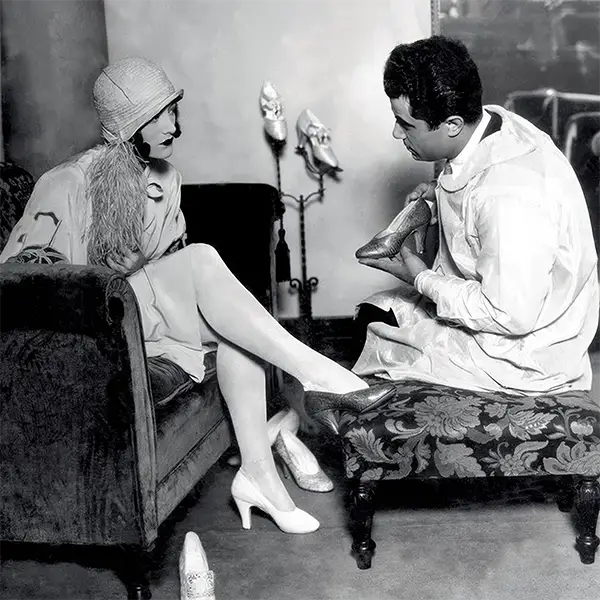 Actor Joan Crawford and Salvatore Ferragamo at the Hollywood Boot Shop, 1920s.