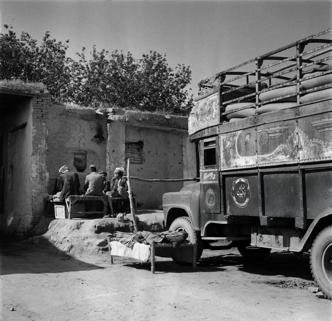 Iranian men rest in a street of Tehran, 1968.