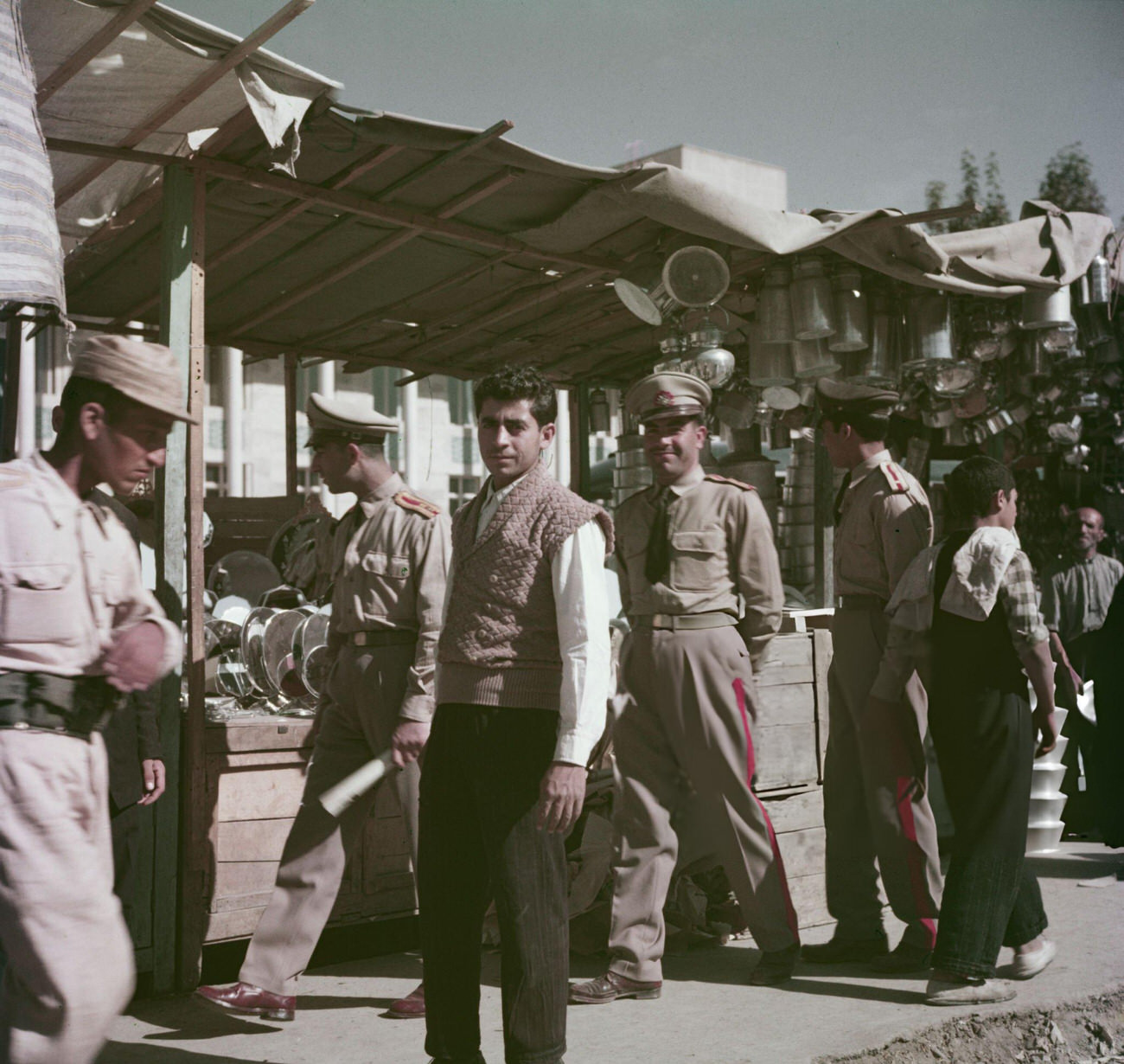 Soldiers from the Imperial Iranian Armed Forces join other customers at a street bazaar in Tehran, 1960s.