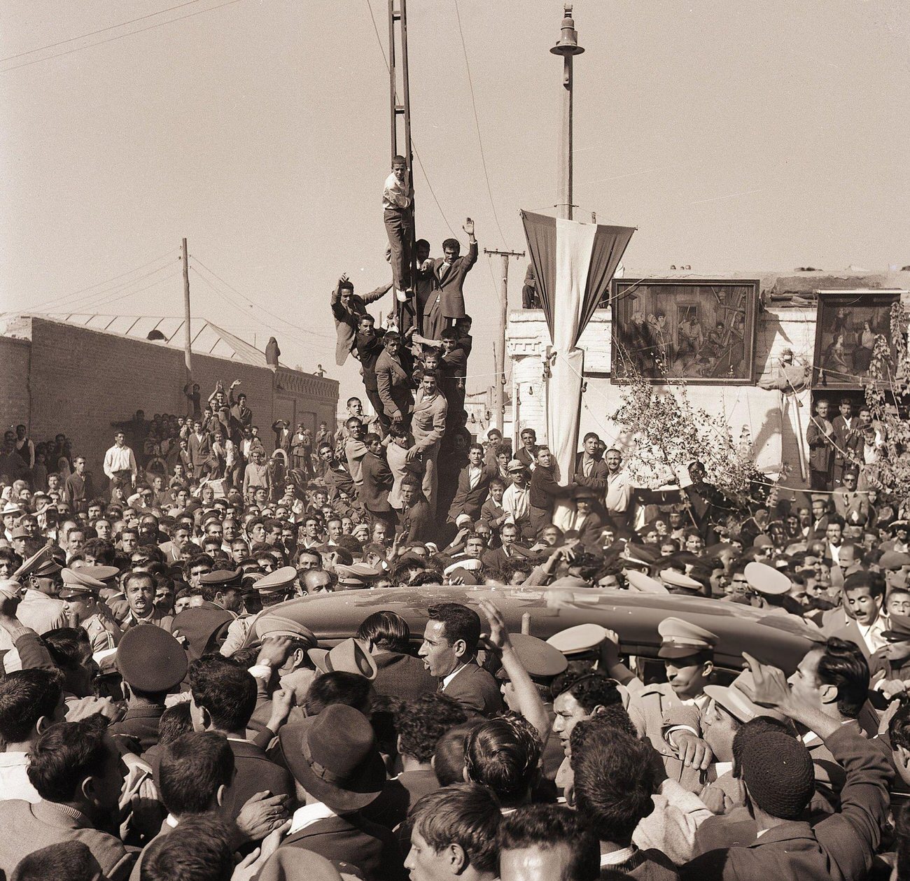 Crowds celebrate the birth of a son to the Shah of Iran, 1960.