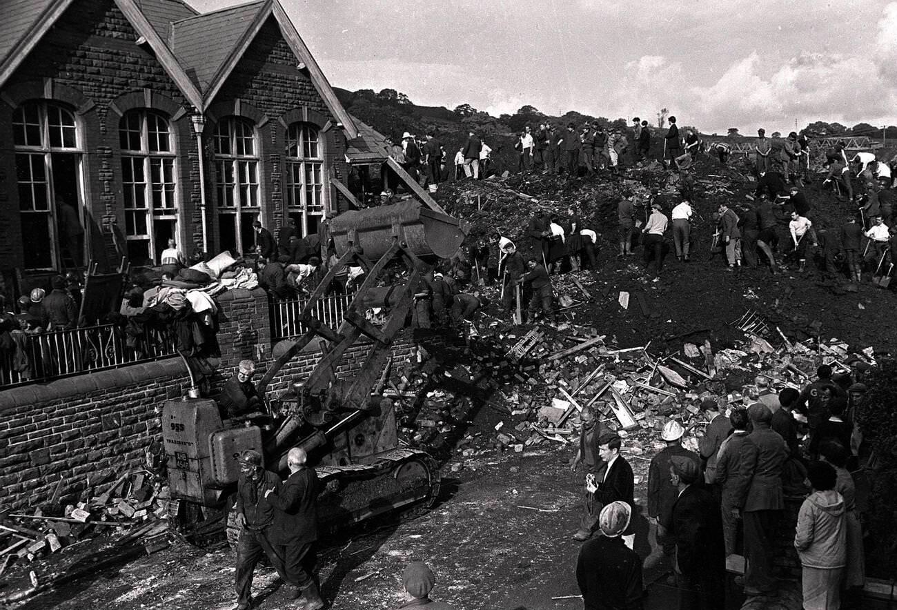 Landslides, disaster, school engulfed by coal tip killing children and teachers buried in the school and surrounding area, 1966.