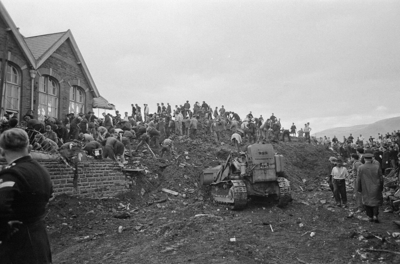 Local men, emergency services all dig for possible signs of life at the Pantglas Junior School, which has collapsed in a catastrophic mud slide, 1966.