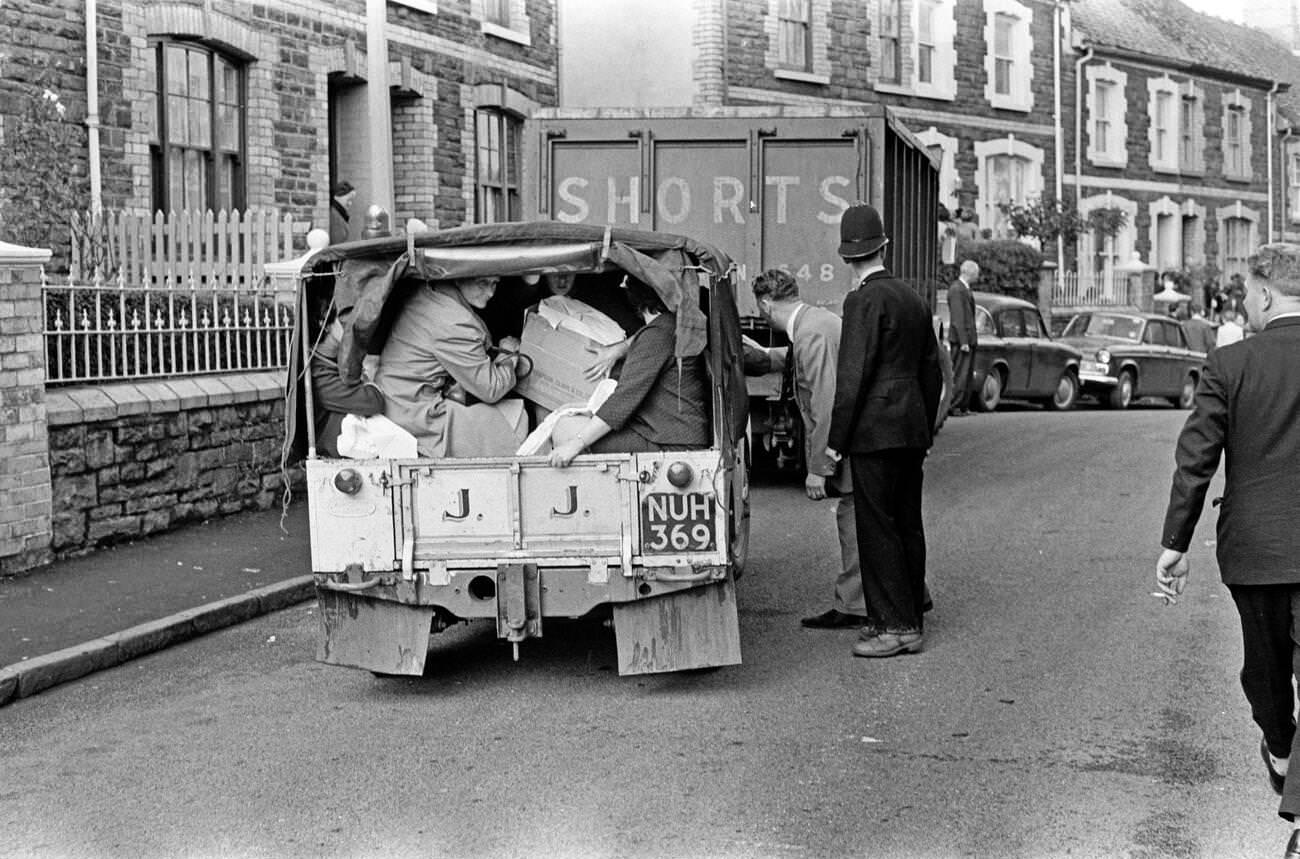 Local villagers help each other, ferrying each other in whatever vehicles they can to deliver supplies and get people to safety, 1966.