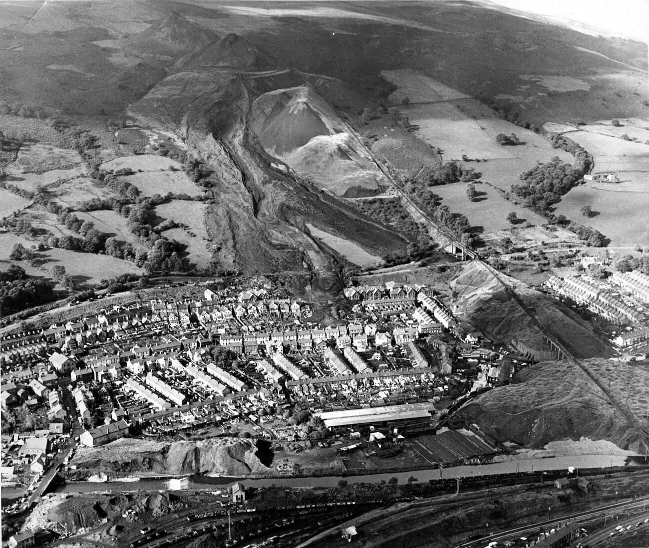 An aerial view of the scene of the disaster where a sea of mud and coal dust smashed through the school and a row of houses, 1966.