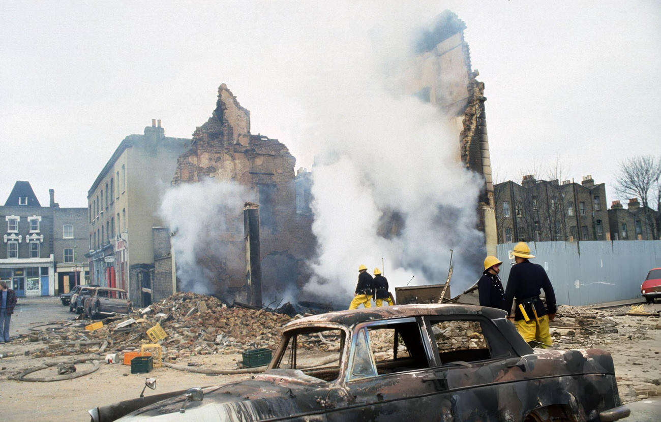 The aftermath of the Brixton Riot, showing damaged cars and buildings that had been set on fire in Brixton, London, 1981.