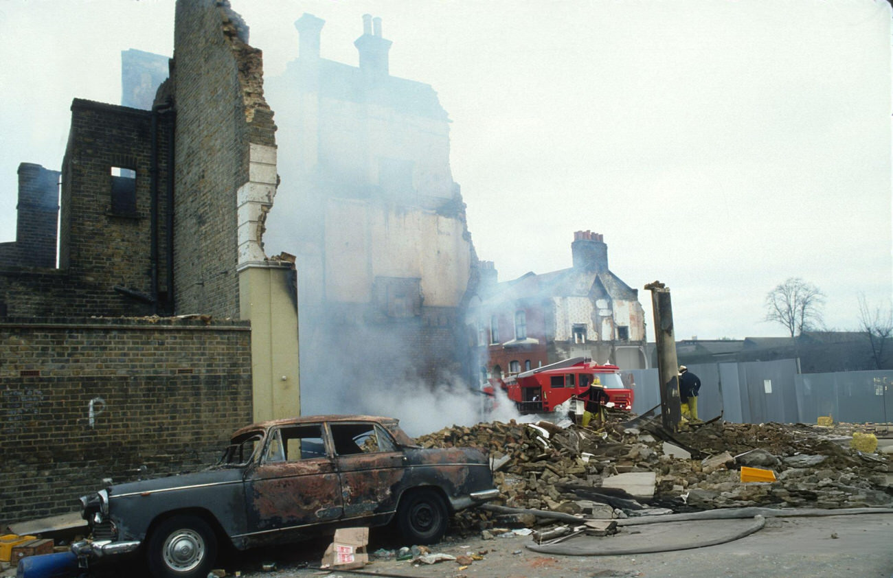 The aftermath of the Brixton Riot, showing damaged cars and buildings that had been set on fire in Brixton, London, 1981.