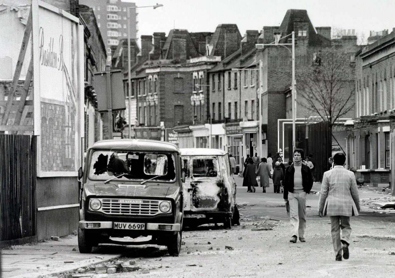 A street in Brixton, south London after a night of severe riots, 1981.