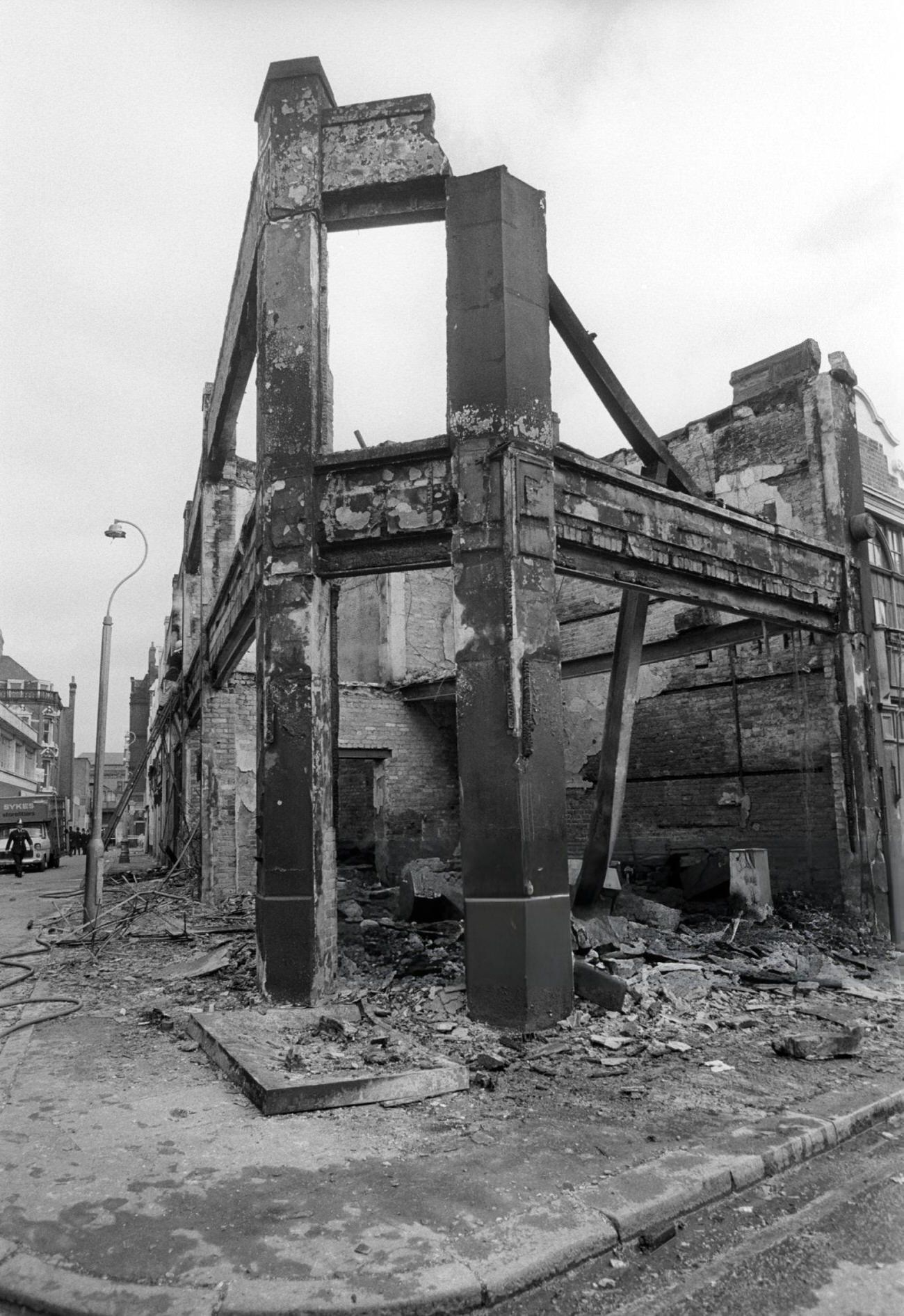 Remains of a corner shop on Electric Lane and Coldharbour Lane, Brixton. This was one of many buildings gutted by fire during rioting the previous day. There were at least 12 major fires in the area, 1981.