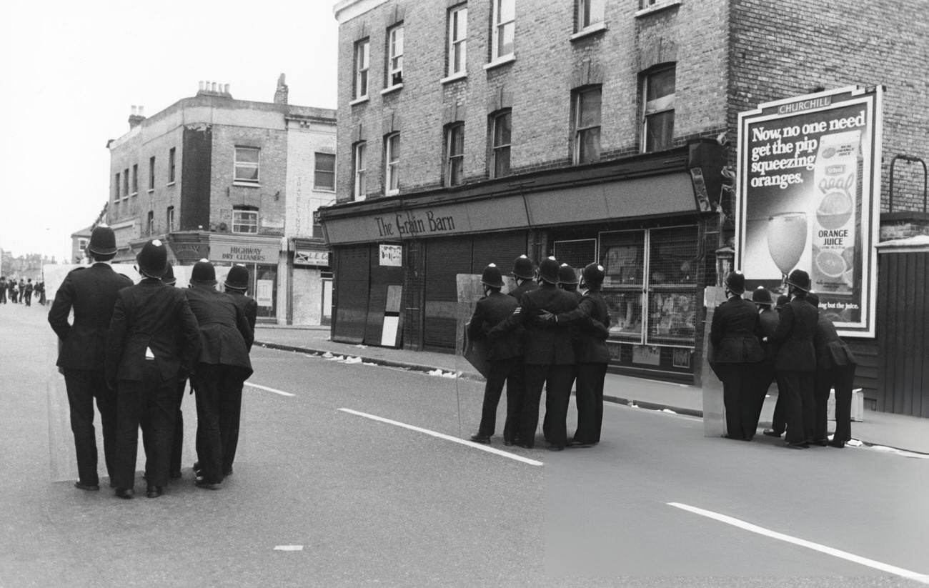 Riots in a predominantly Afro-Caribbean neighborhood in Brixton, London, 1981.