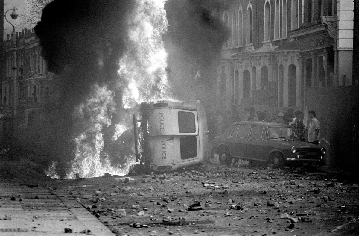 A police van on fire during the riot in Brixton, South London. 23 police officers were injured, 3 seriously, in attacks by brick throwing youths, 1981.