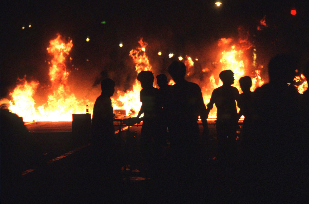 Buses and vehicles burn as demonstrators retreat down Changan Avenue on June 4, 1989.