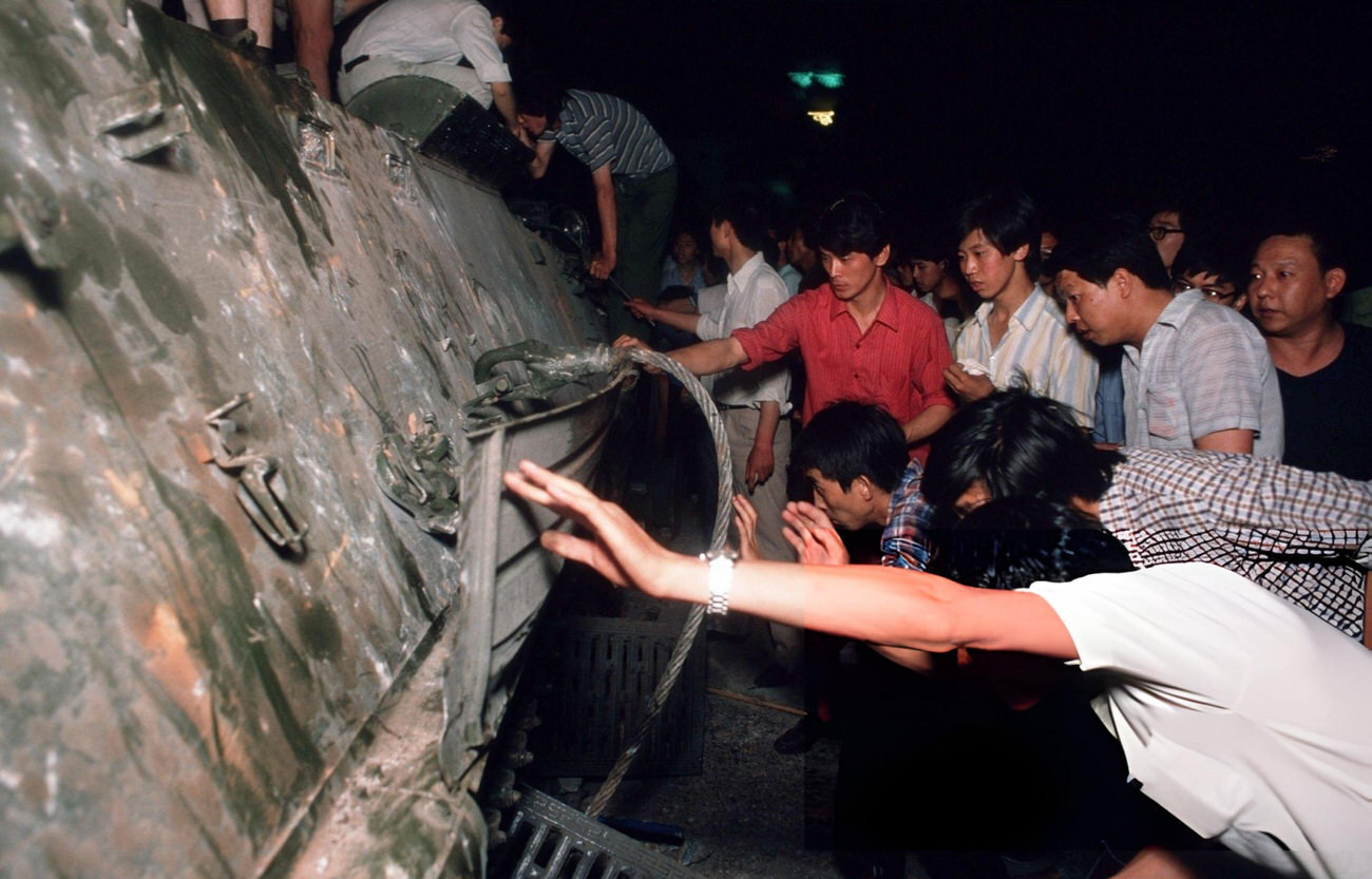 Pro-democracy demonstrators inspect an armored personnel carrier, 1989.