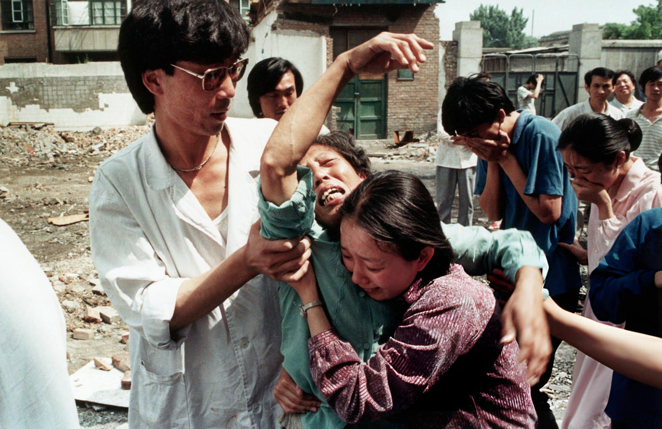 Family members try to comfort a grief-stricken mother, 1989.