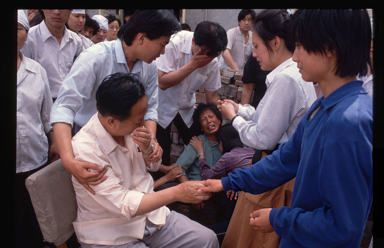 Parents mourn the death of their son, 1989.