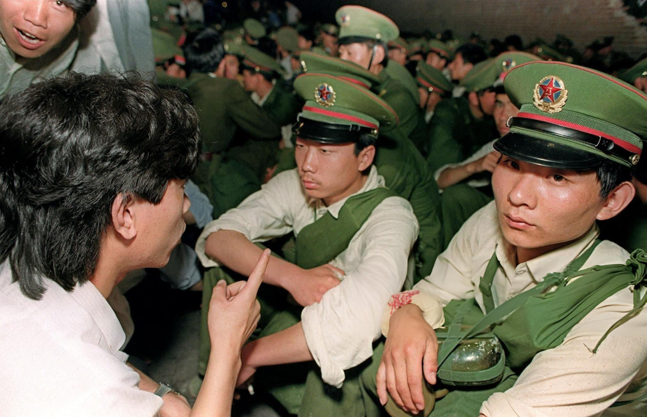 A dissident student asks soldiers to go back home, 1989.