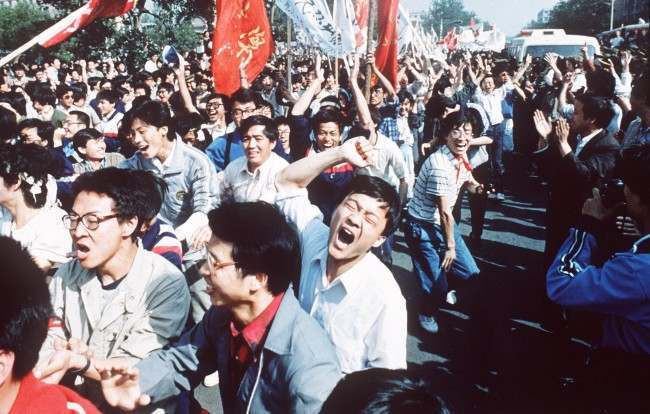 Chinese students shout after breaking through a police blockade during a pro-democracy march to Tiananmen Square, Bejing, May 4 1989.