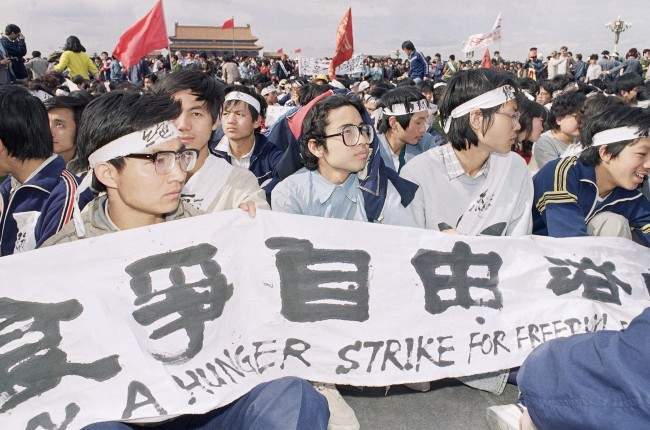 University students sit in Tiananmen Square on Saturday, May 13, 1989 in Beijing on a hunger strike for freedom and democracy. The students vow to sit until the arrival of Soviet leader Mikhail Gorbachev on Monday.